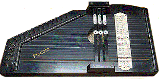 This 'Picollo' autoharp is credited to Meinhold though I have found little other information about it.  It's likely to be a newer model than the next two shown, because Meinhold didn't start giving his models names right away.  Sorry, I don't have a bigger photo.